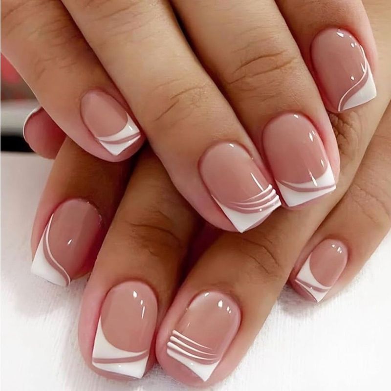 French tip nails with fine line detail at a nail salon in Florence, Kentucky